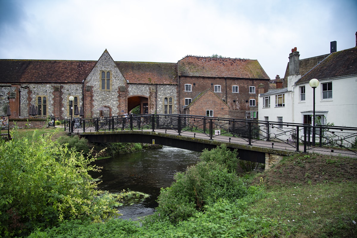 brown brick house near bridge